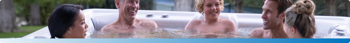 A family enjoying a relaxing moment together in an outdoor hot tub.
